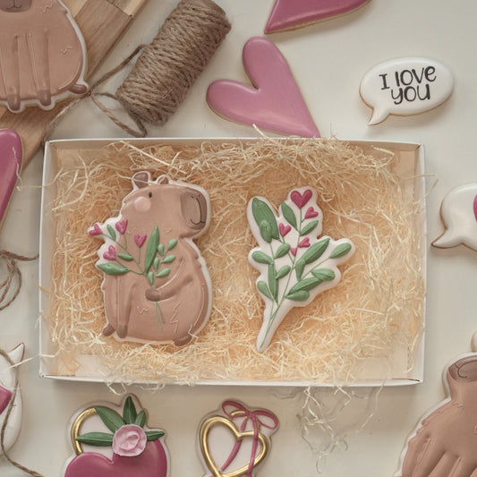 Capibara con mazzo di fiori